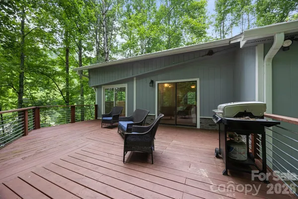 a view of a house with backyard sitting area
