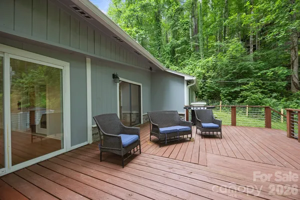 a view of a patio with wooden floor and outdoor seating