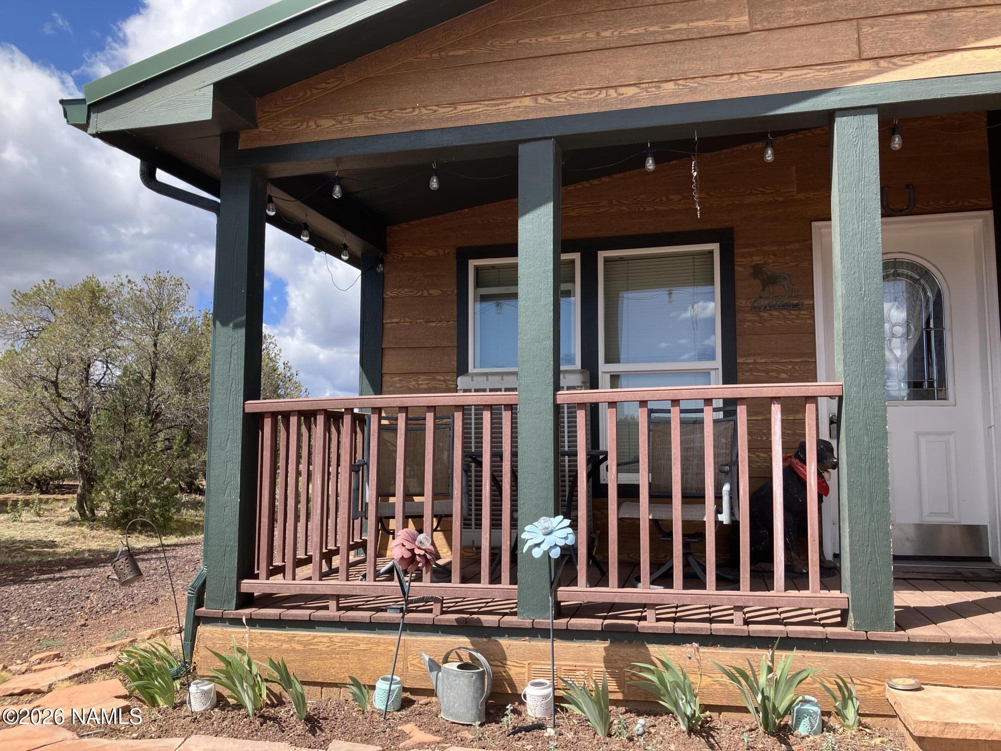 1431 East Cedar Road Williams, AZ 86046 - Photo 4 of 51 a view of a house with a wooden fence