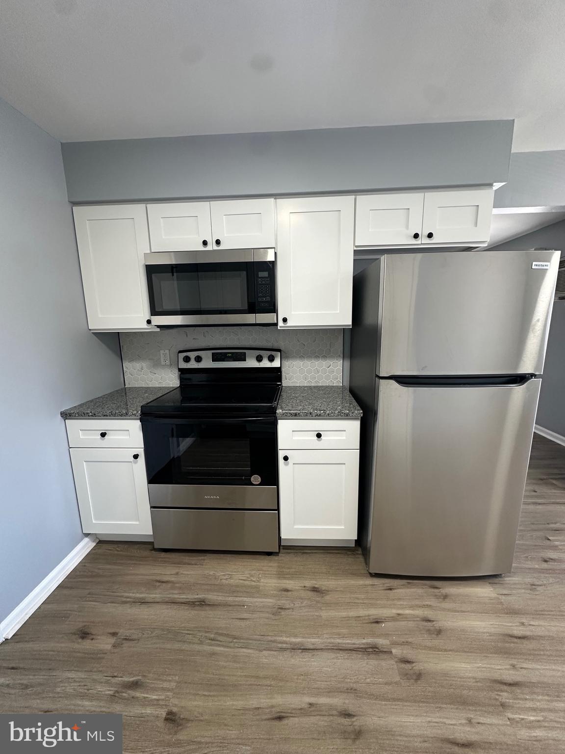 612 North Shady Retreat Road, Unit 14 Doylestown, PA 18901 - Photo 12 of 17 a kitchen with stainless steel appliances a refrigerator sink and stove