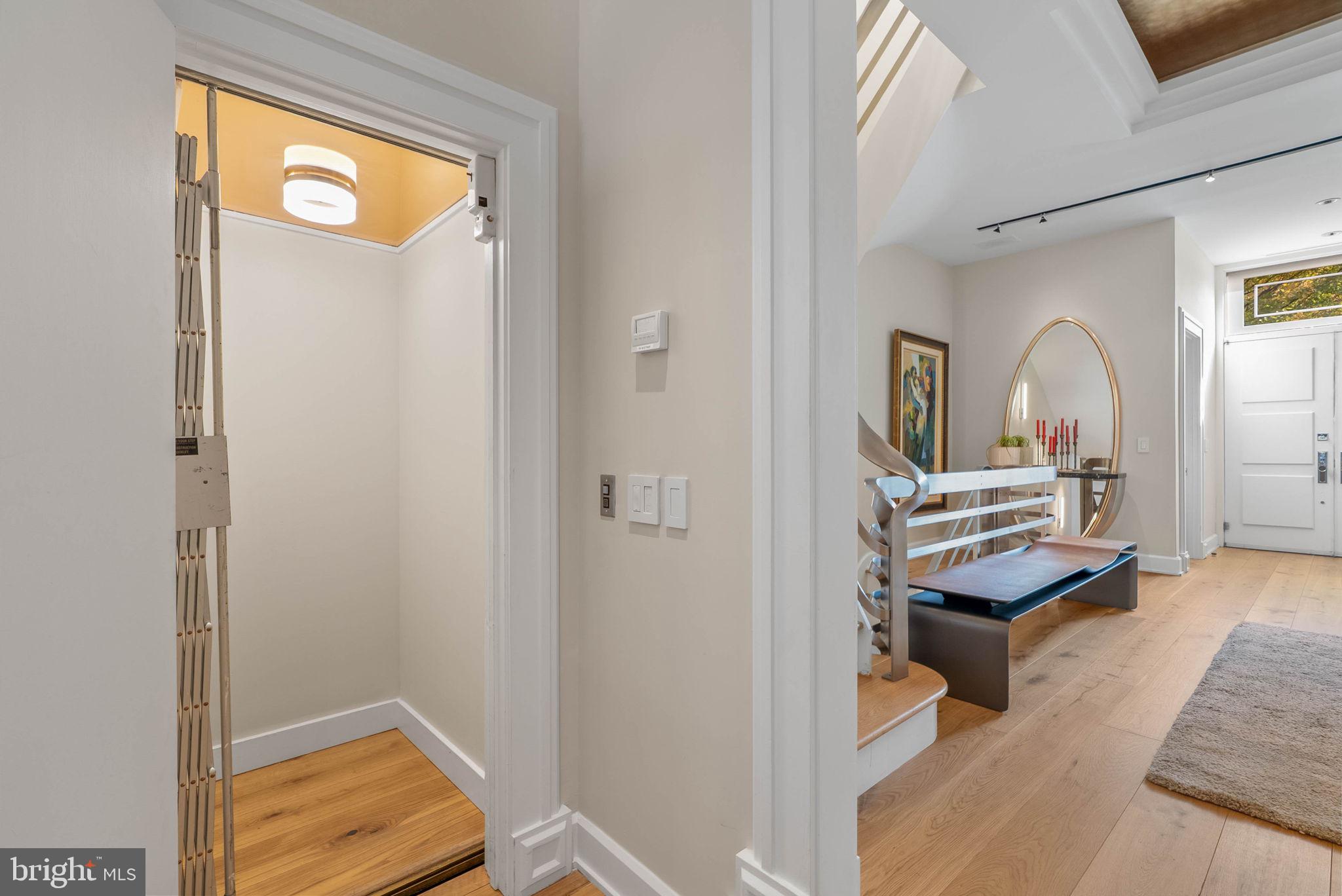 254 South 3rd Street Philadelphia, PA 19106 - Photo 17 of 73 a view of a hallway with entryway wooden floor and windows