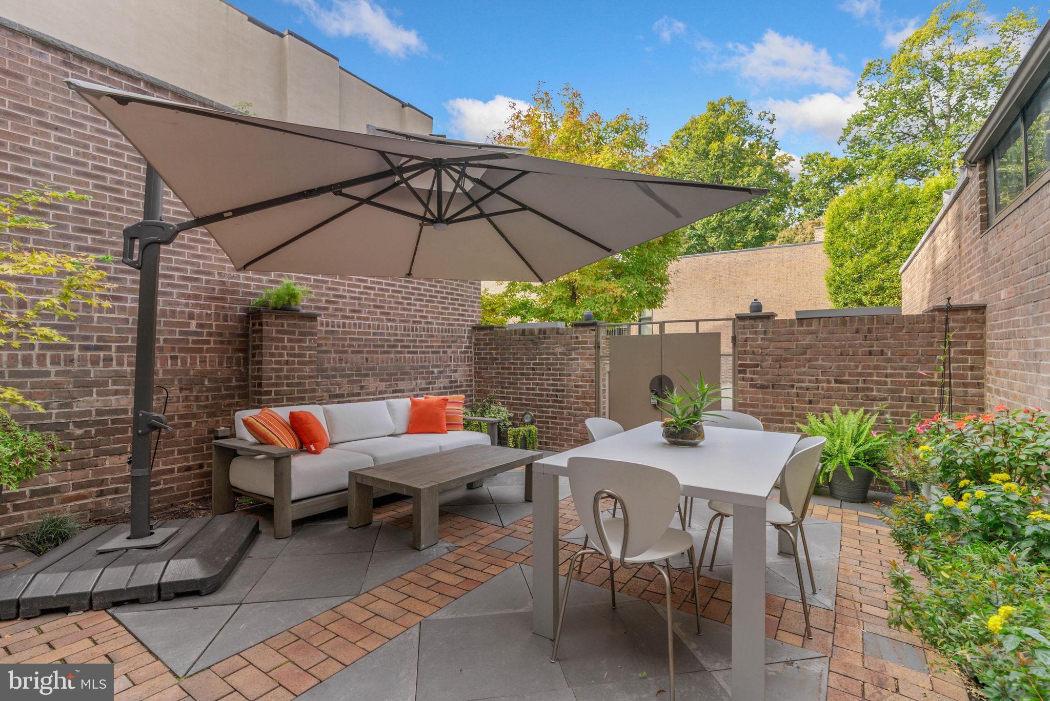 254 South 3rd Street Philadelphia, PA 19106 - Photo 21 of 73 a view of patio with table and chairs under an umbrella
