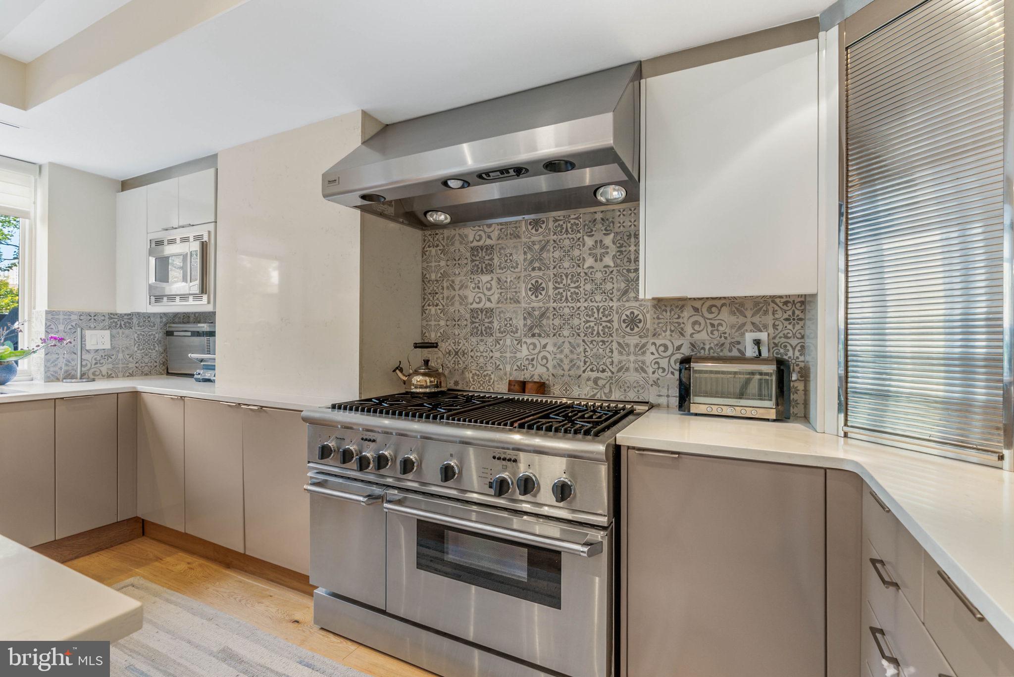 254 South 3rd Street Philadelphia, PA 19106 - Photo 38 of 73 a kitchen with a stove and a sink