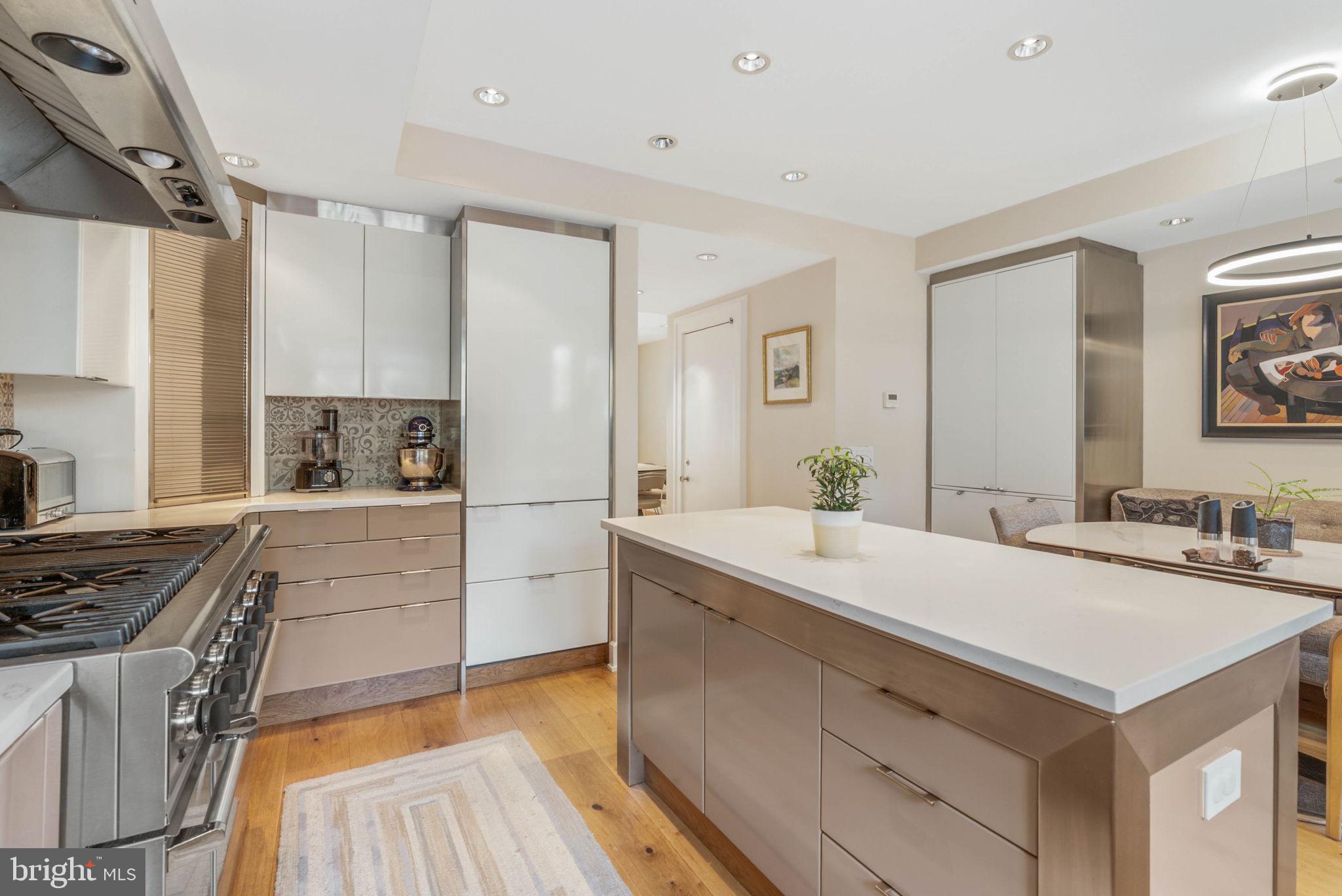 254 South 3rd Street Philadelphia, PA 19106 - Photo 40 of 73 a kitchen with a sink stove and refrigerator