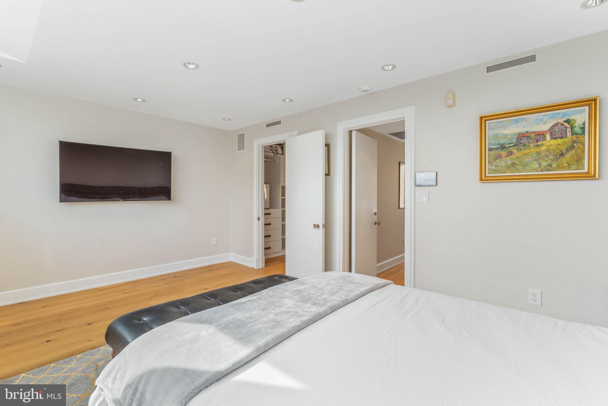 254 South 3rd Street Philadelphia, PA 19106 - Photo 55 of 73 a bedroom with a bed and a flat screen tv