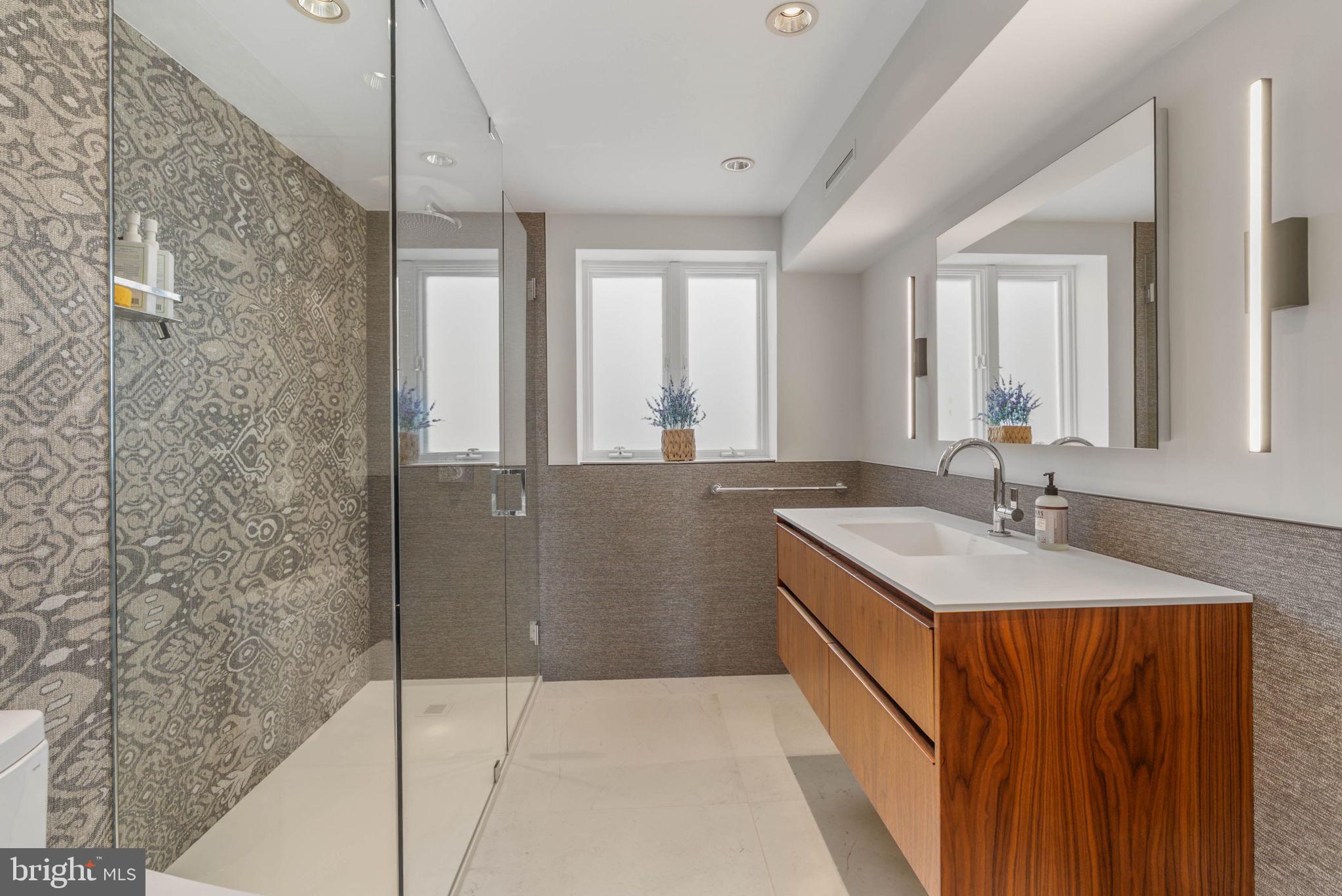 254 South 3rd Street Philadelphia, PA 19106 - Photo 57 of 73 a bathroom with a granite countertop sink and a mirror