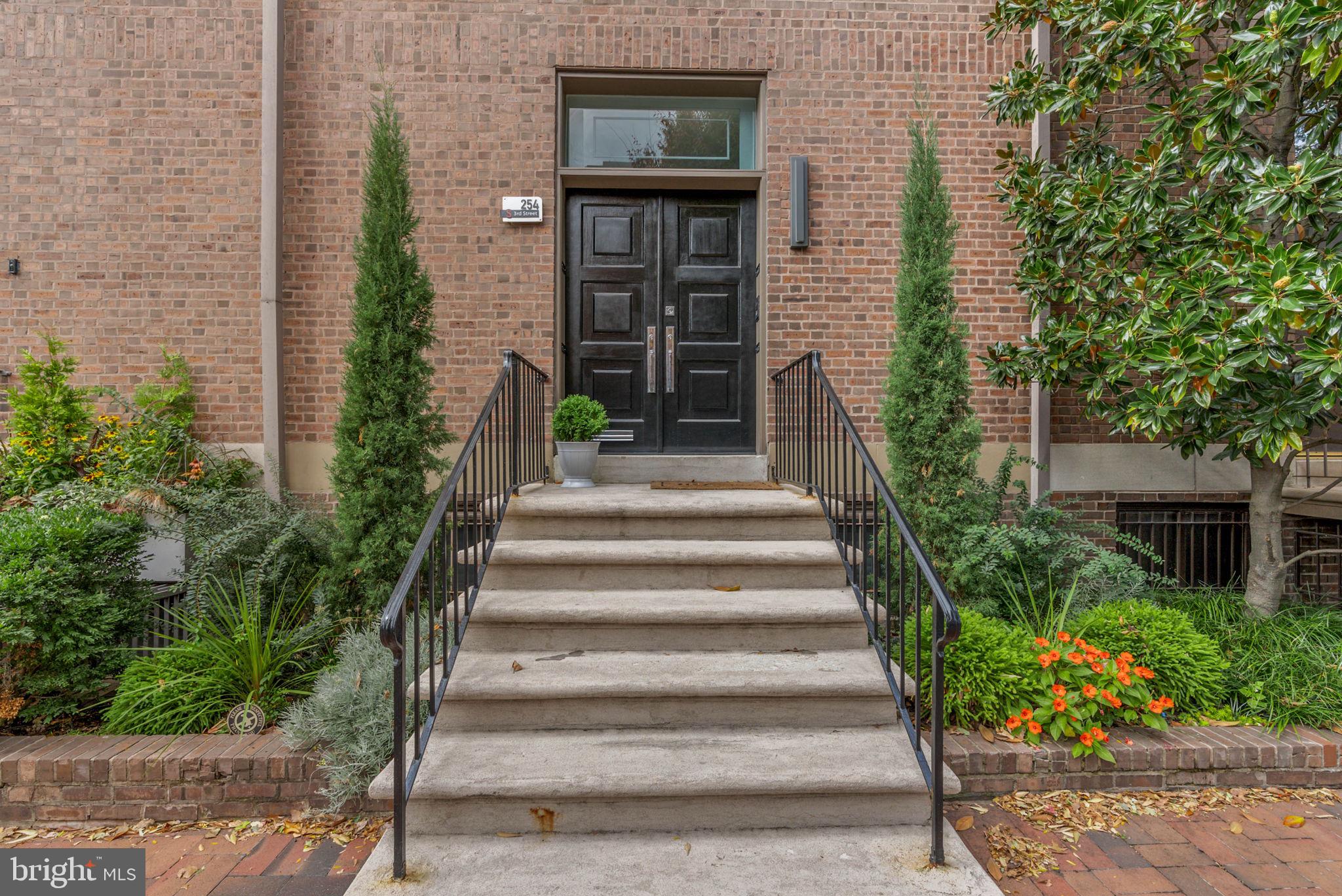 254 South 3rd Street Philadelphia, PA 19106 - Photo 8 of 73 a view of a brick house with plants and large tree