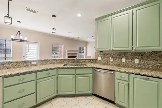 a kitchen with a sink and cabinets