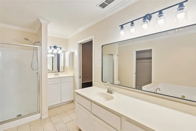 a bathroom with a double vanity sink mirror and shower