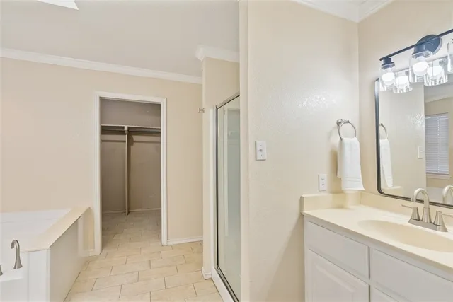 a bathroom with a double vanity sink mirror and