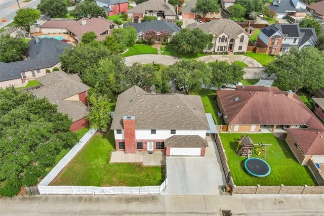 an aerial view of residential house with outdoor space and street view