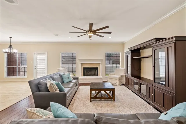 a living room with furniture tv and a fireplace