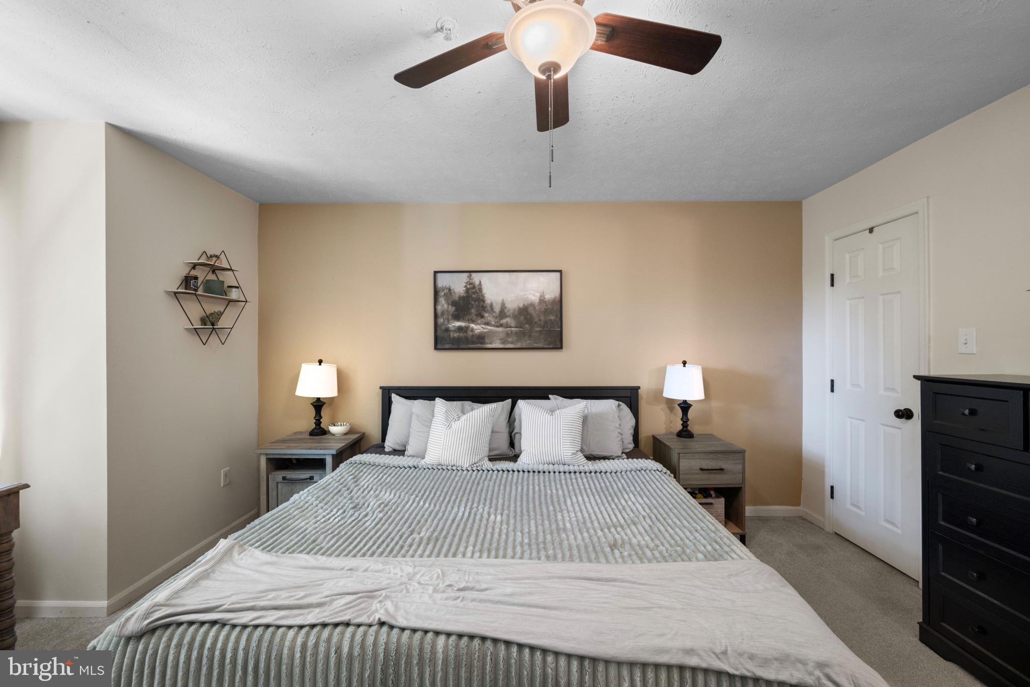 3105 Cardinal Way, Unit L Abingdon, MD 21009 - Photo 12 of 31 a bedroom with a bed and wooden floor