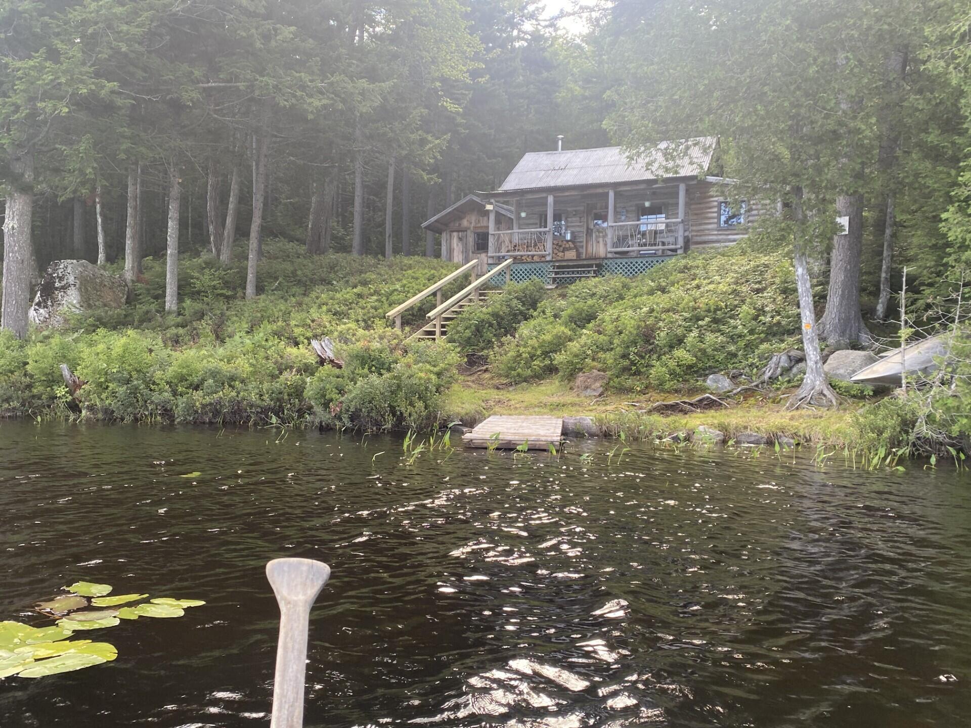 Lot 14 Rowe Pond Road Bingham, ME 04920 - Photo 2 of 49 Closer view cabin from the pond