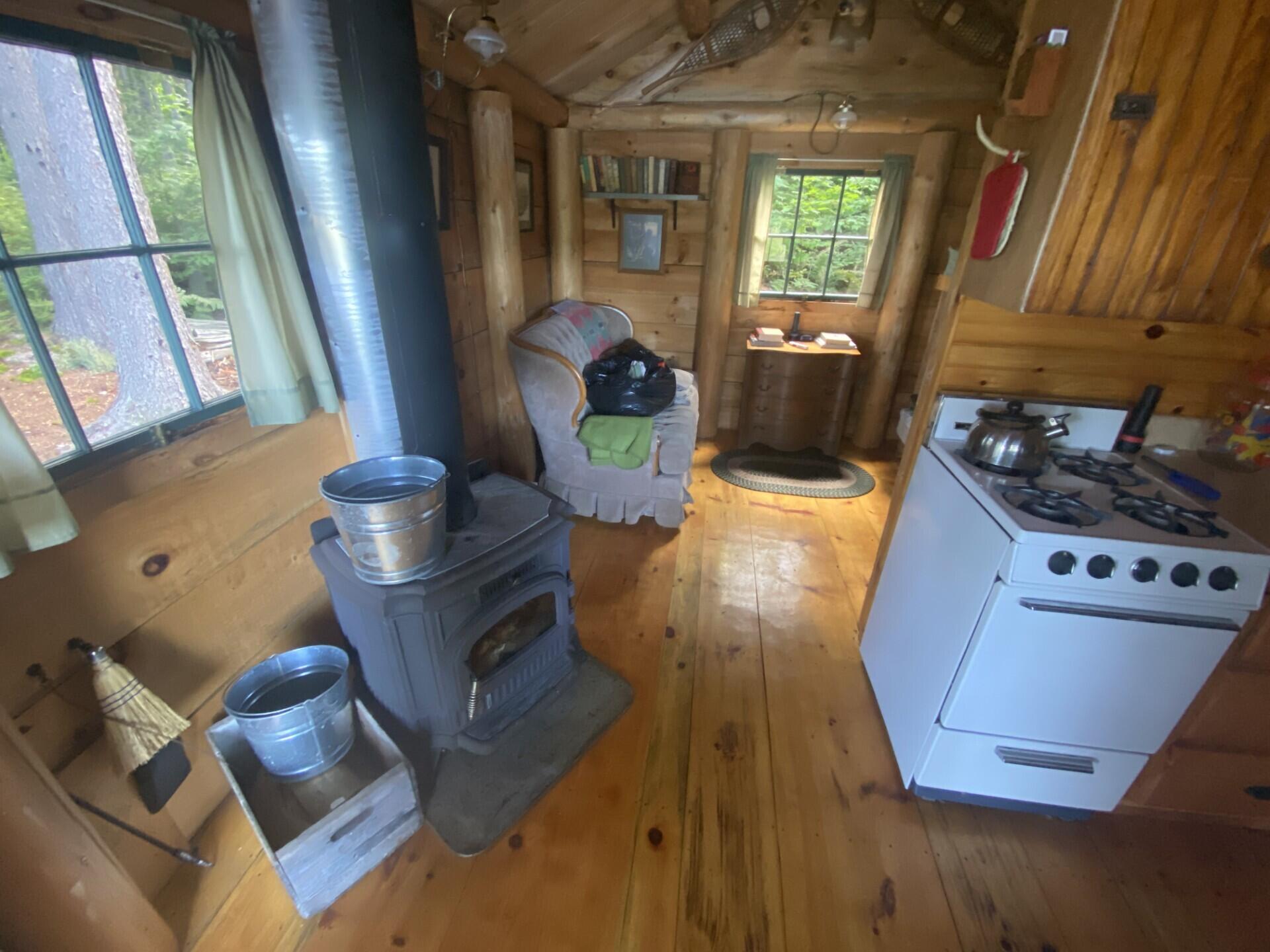 Lot 14 Rowe Pond Road Bingham, ME 04920 - Photo 25 of 49 Woodshed kitchen and stove