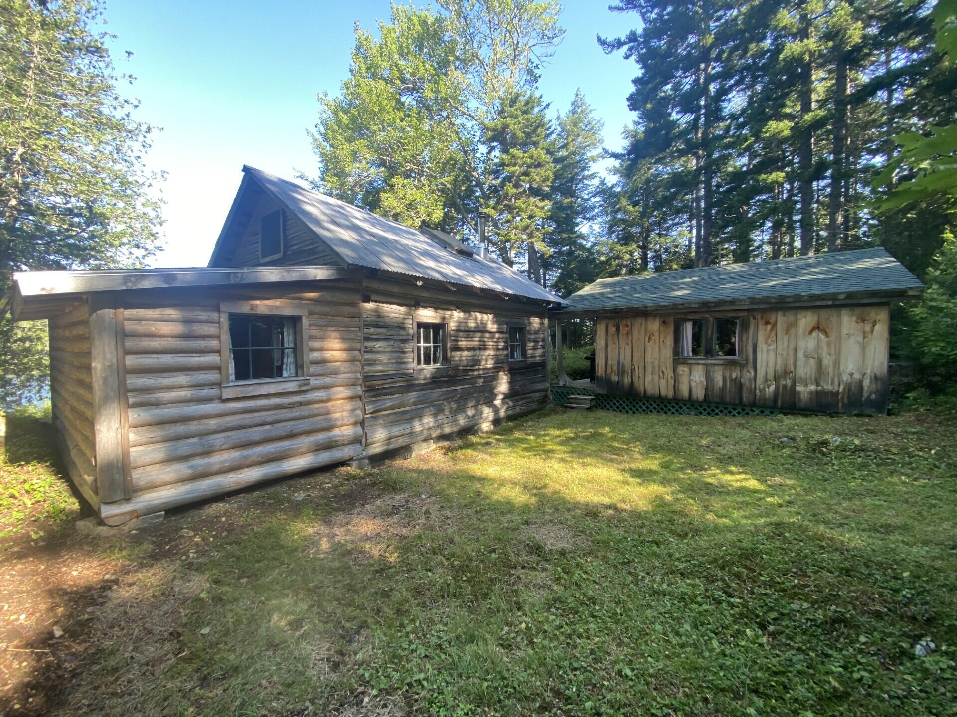 Lot 14 Rowe Pond Road Bingham, ME 04920 - Photo 3 of 49 Main cabin and the woodshed cabin