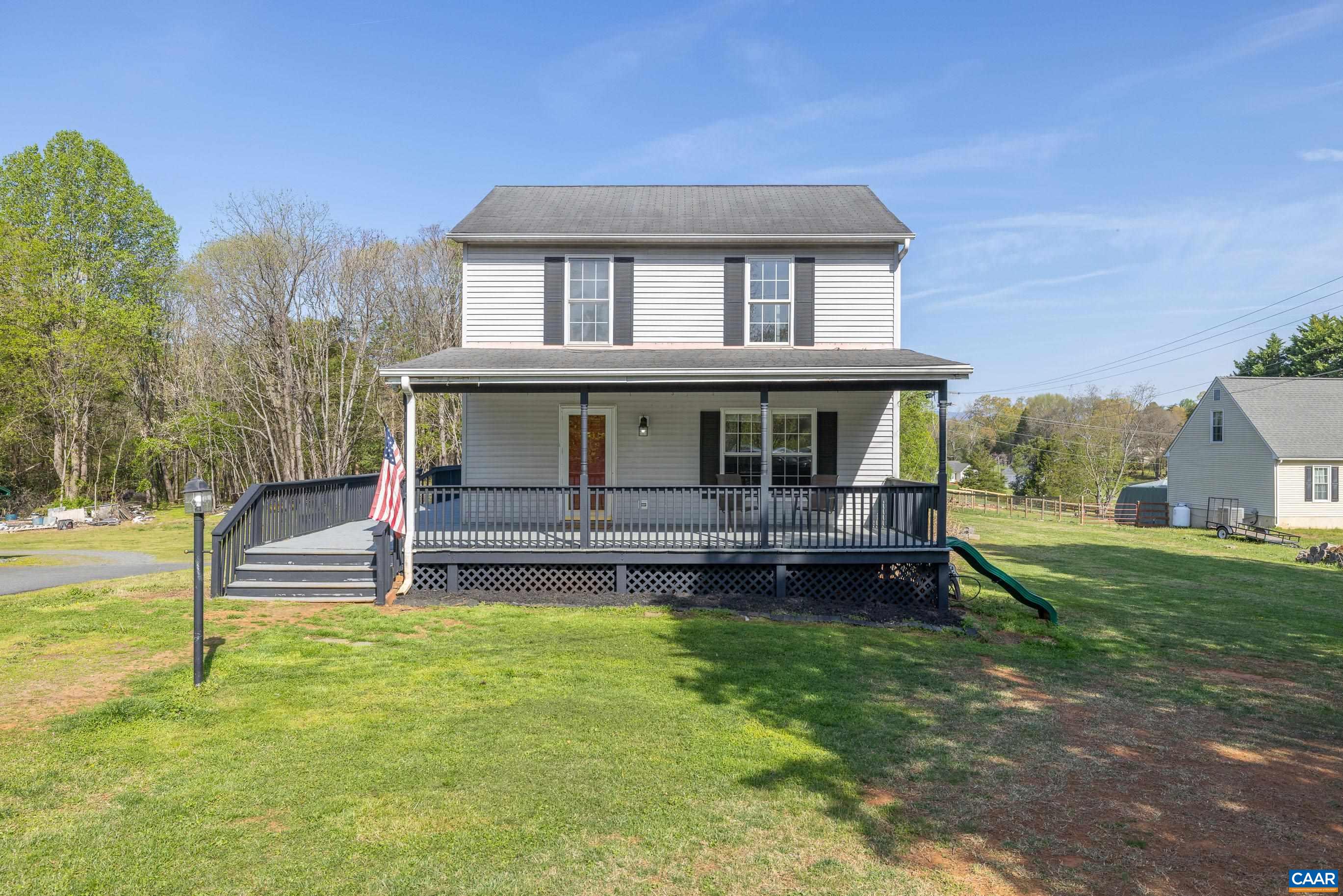 6183 Spring Hill Road Ruckersville, VA 22968 - Photo 1 of 31 a view of a house with a yard and sitting area
