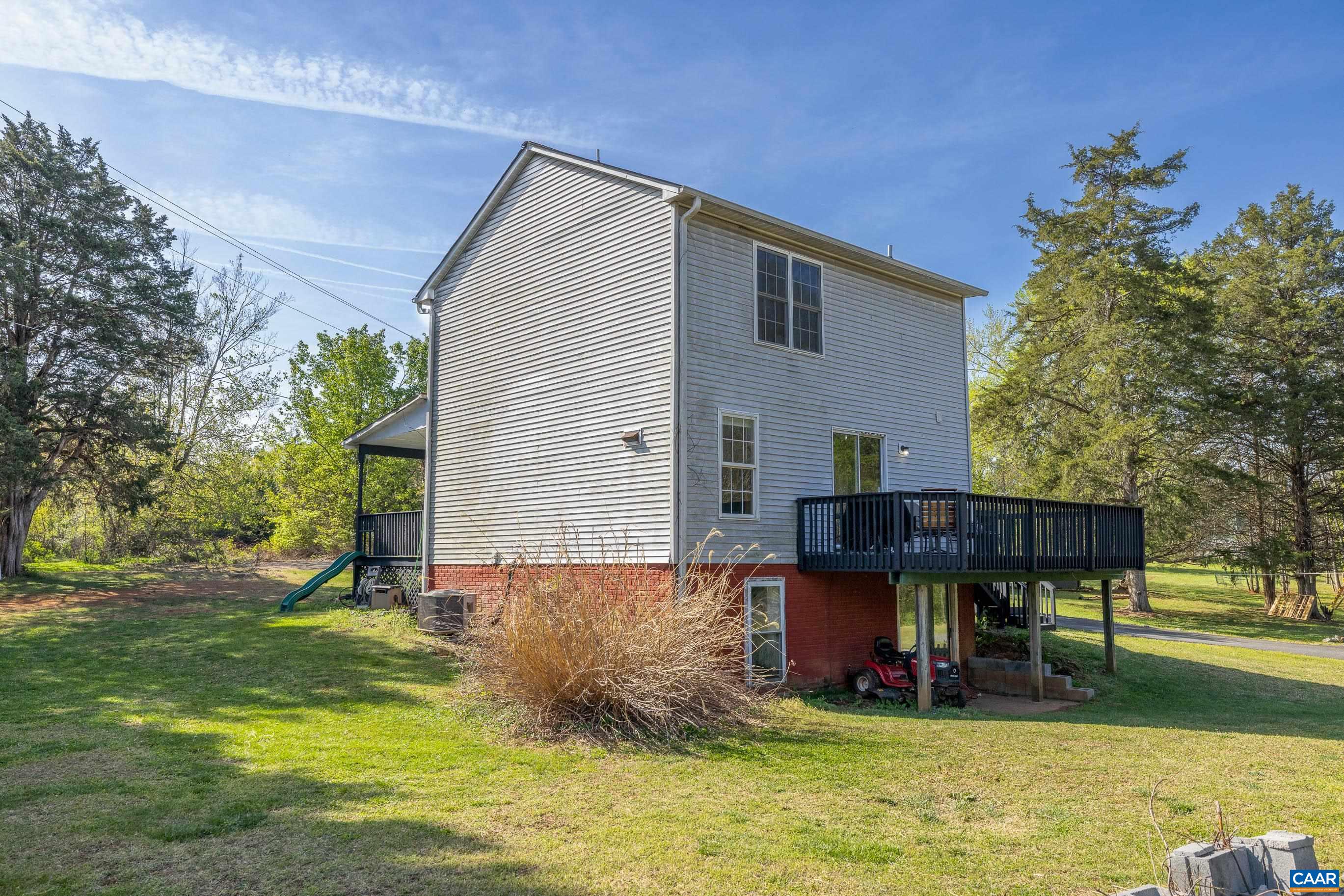6183 Spring Hill Road Ruckersville, VA 22968 - Photo 11 of 31 a backyard of a house with yard and swimming pool