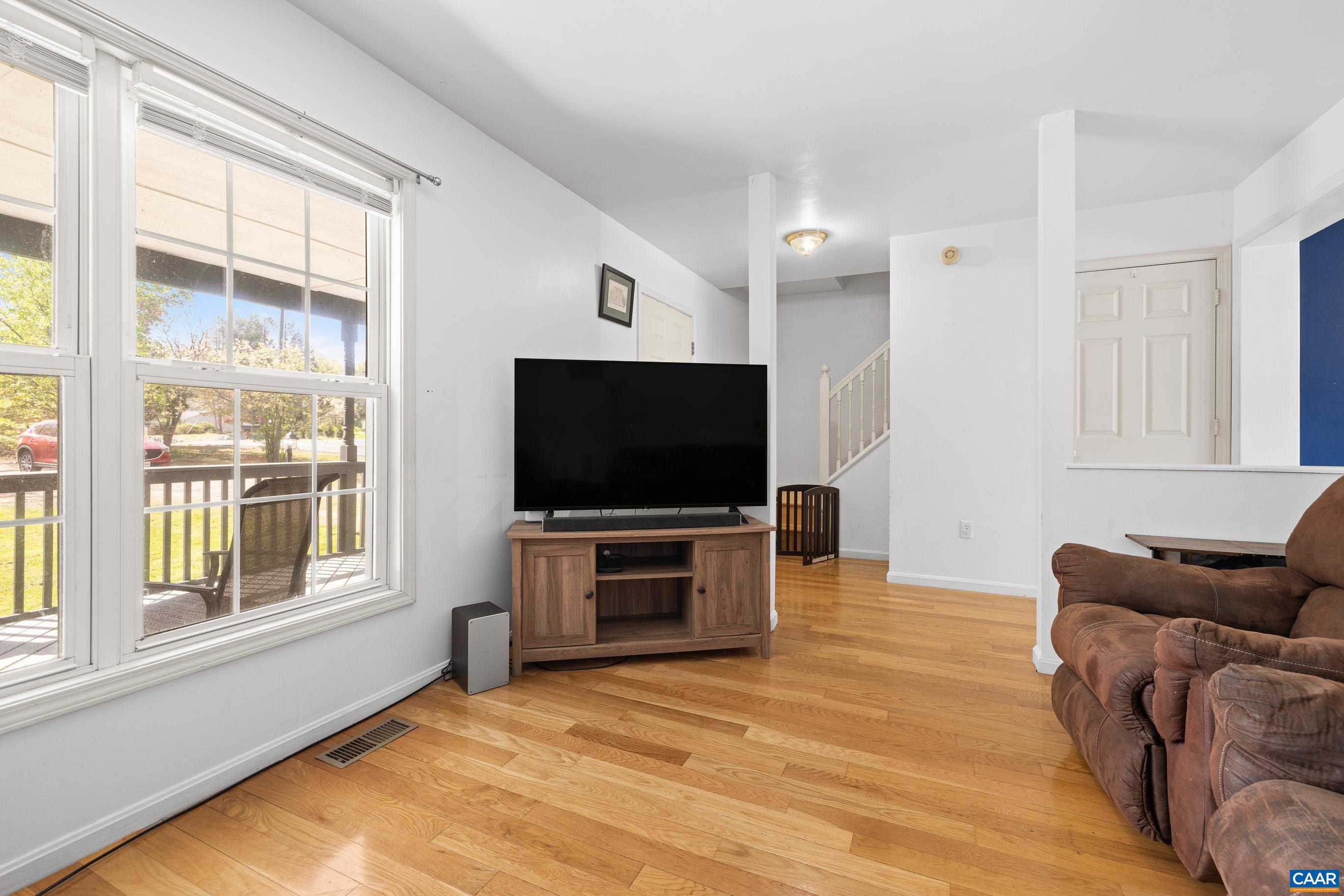 6183 Spring Hill Road Ruckersville, VA 22968 - Photo 20 of 31 a living room with furniture and a flat screen tv