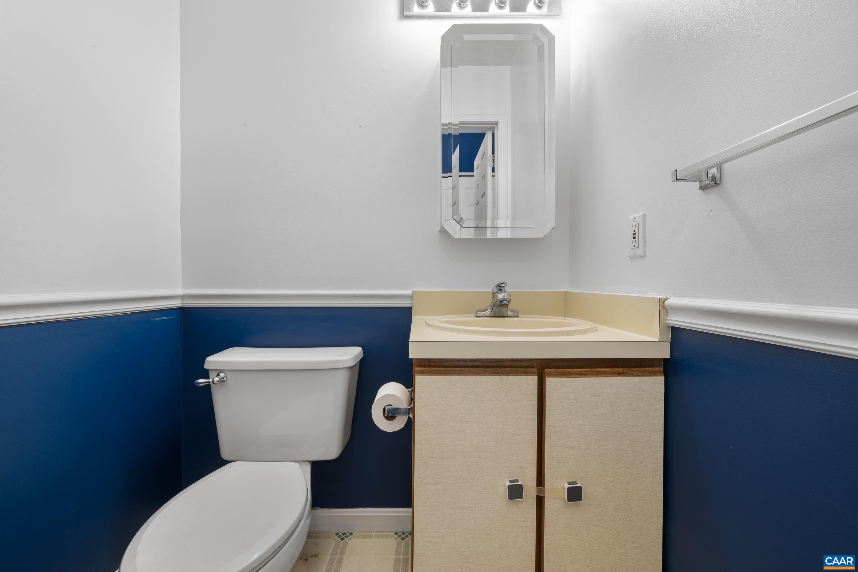 6183 Spring Hill Road Ruckersville, VA 22968 - Photo 24 of 31 a bathroom with a toilet sink and mirror