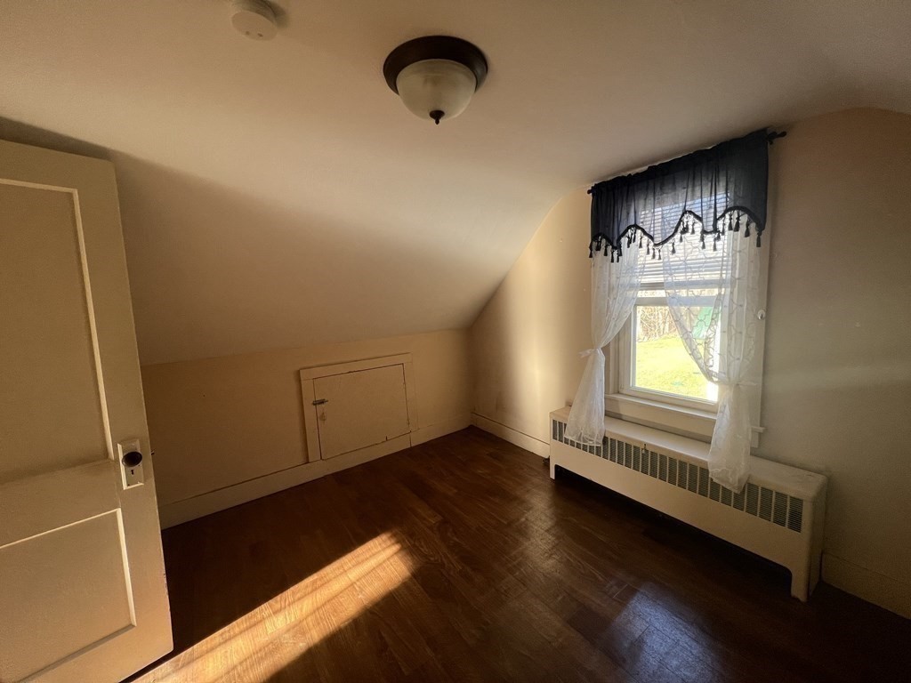 52 Chestnut Street Rehoboth, MA 02769 - Photo 11 of 16 an empty room with wooden floor and windows