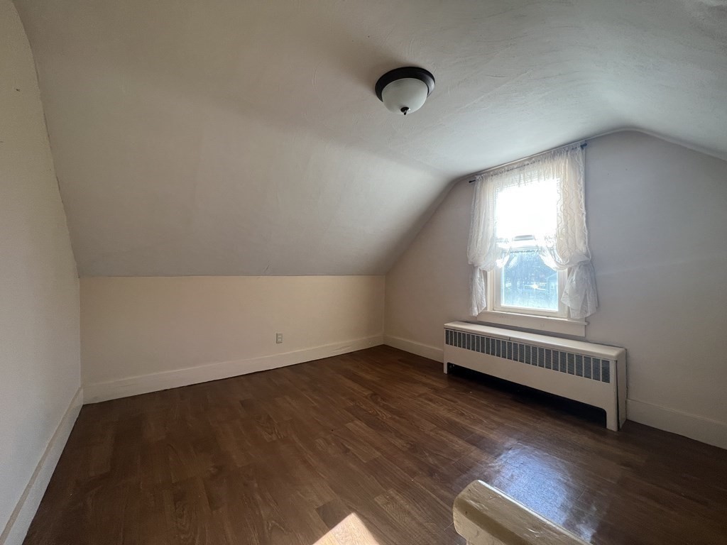 52 Chestnut Street Rehoboth, MA 02769 - Photo 12 of 16 an empty room with wooden floor and windows