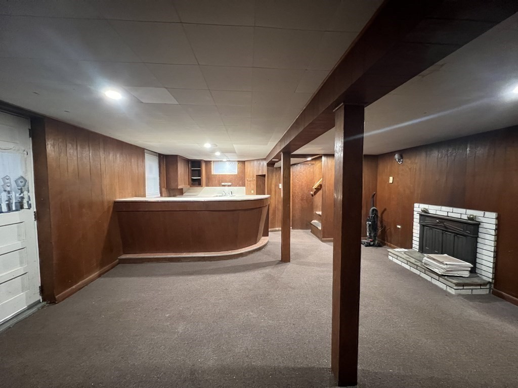 52 Chestnut Street Rehoboth, MA 02769 - Photo 14 of 16 a view of an empty room with a fireplace