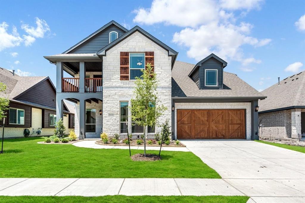 2133 Devonblue Drive Forney, TX 75126 - Photo 1 of 34 a front view of a house with a yard