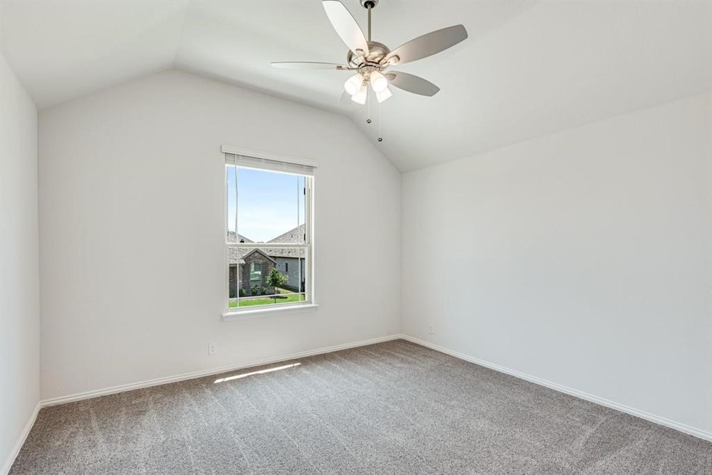 2133 Devonblue Drive Forney, TX 75126 - Photo 18 of 34 an empty room with windows and fan