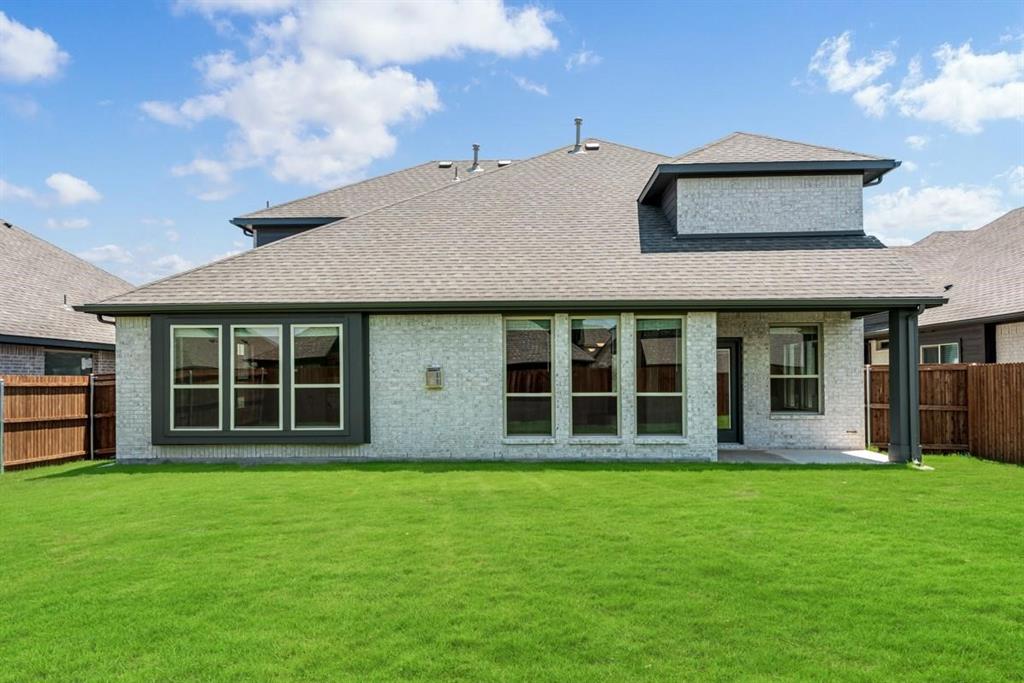 2133 Devonblue Drive Forney, TX 75126 - Photo 33 of 34 a front view of a house with a garden