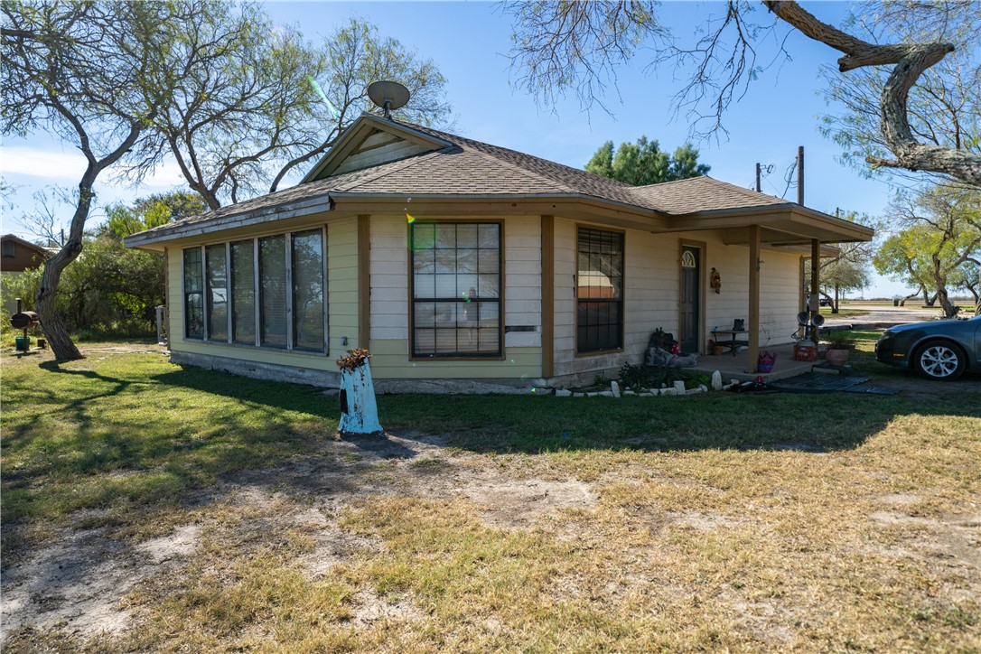 990 East Farm To Market 628 Riviera, TX 78379 - Photo 24 of 39 a front view of a house with a yard and garage