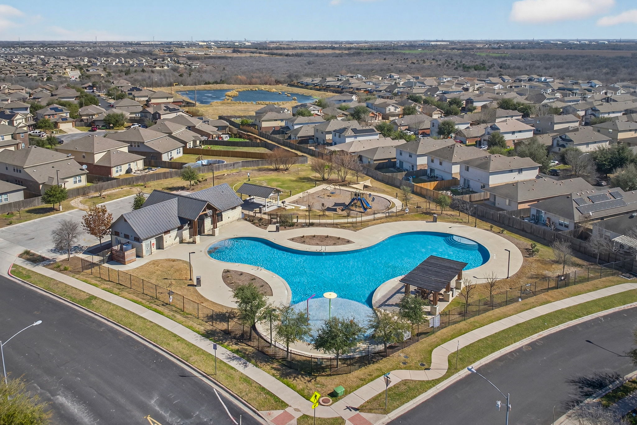 13629 Coomer Path Pflugerville, TX 78660 - Photo 27 of 30 Community pool with a residential view, a patio, and area for grilling