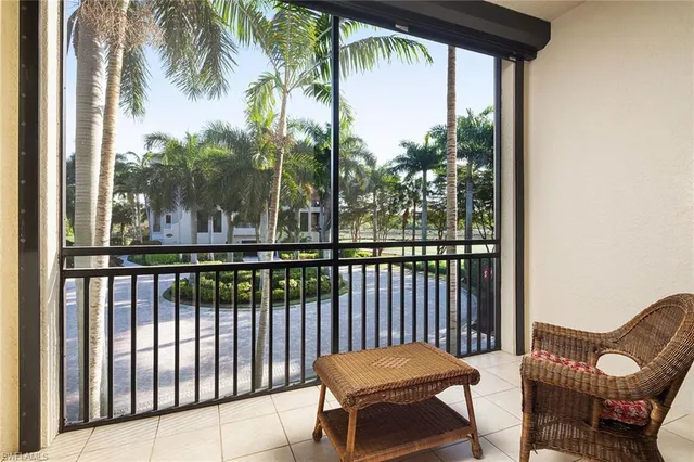 a view of a chairs and table in patio of a house