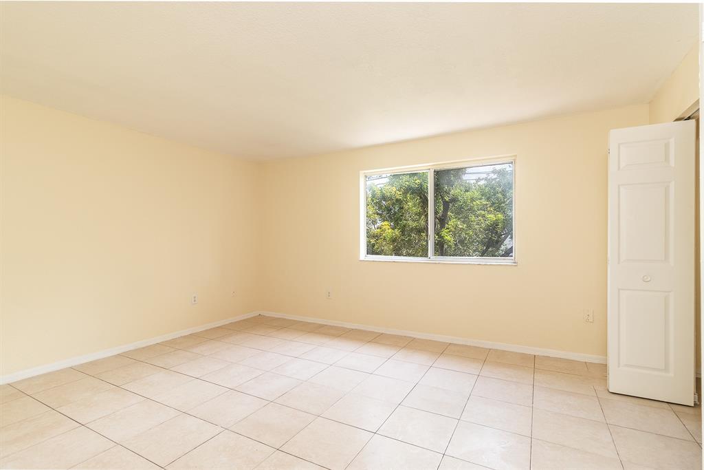 2214 Northwest 135th Terrace Opa-Locka, FL 33054 - Photo 17 of 29 an empty room with a window