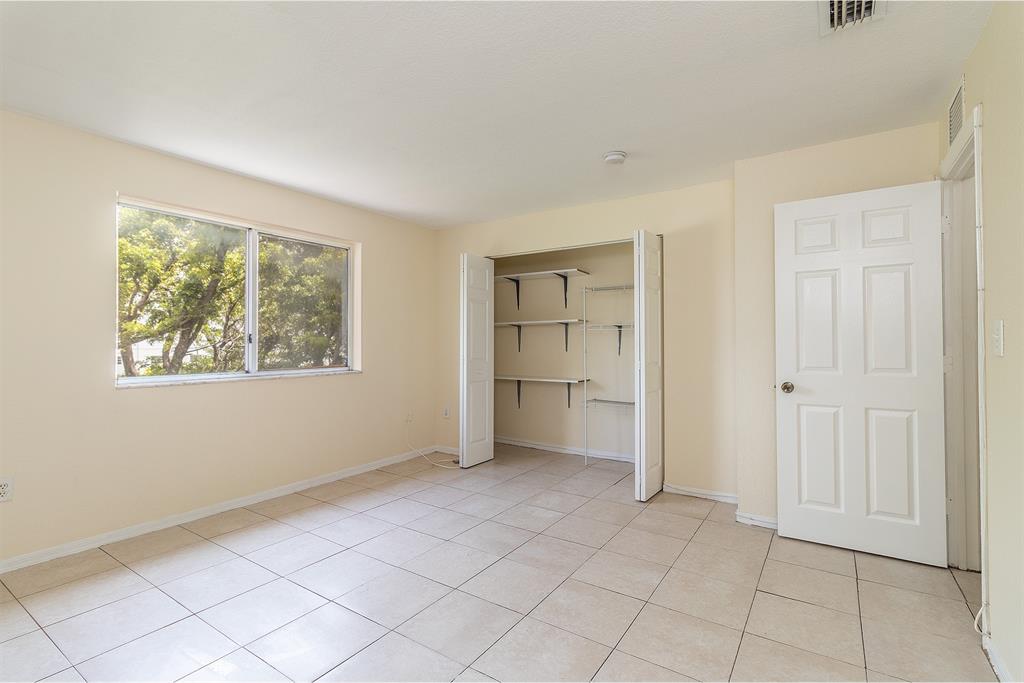 2214 Northwest 135th Terrace Opa-Locka, FL 33054 - Photo 18 of 29 an empty room with windows
