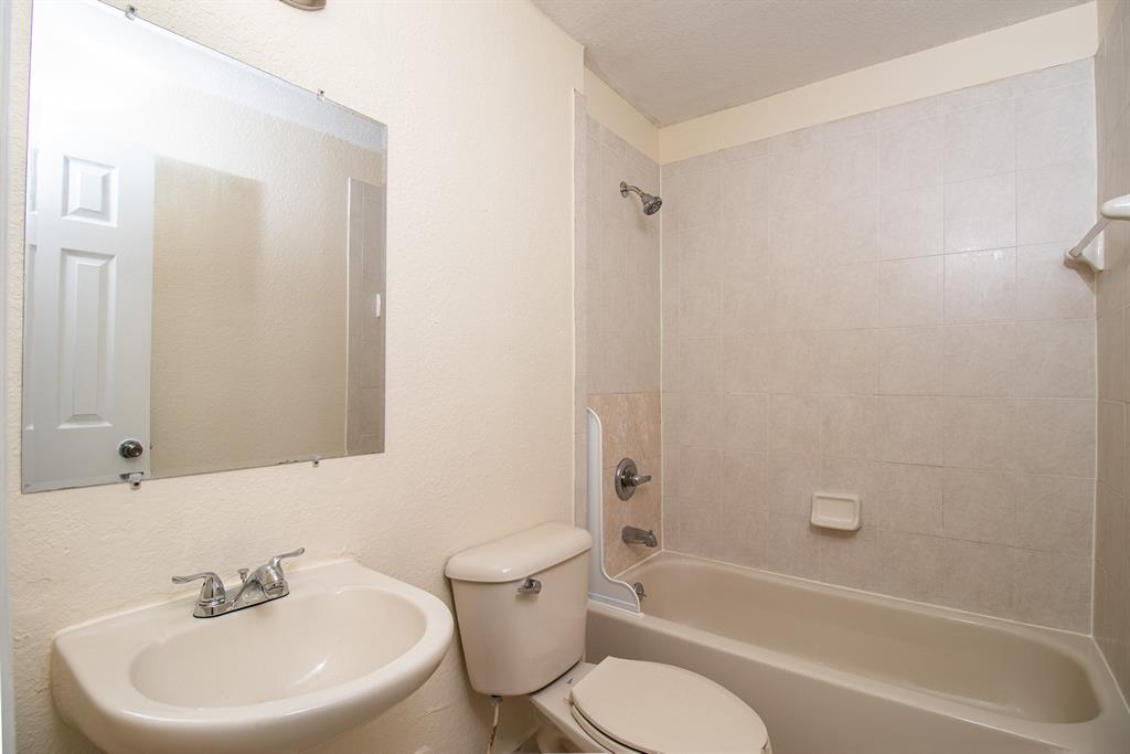 2214 Northwest 135th Terrace Opa-Locka, FL 33054 - Photo 19 of 29 a bathroom with a sink toilet and a bathtub