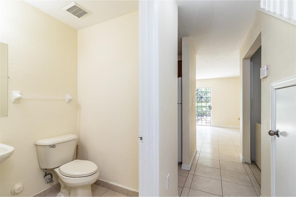 2214 Northwest 135th Terrace Opa-Locka, FL 33054 - Photo 6 of 29 a bathroom with a toilet and a shower