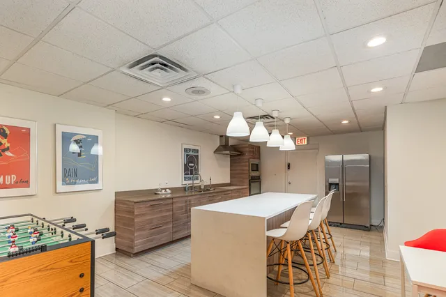 a kitchen with a table and chairs in it