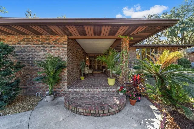a view of a kitchen with a sink and a large window