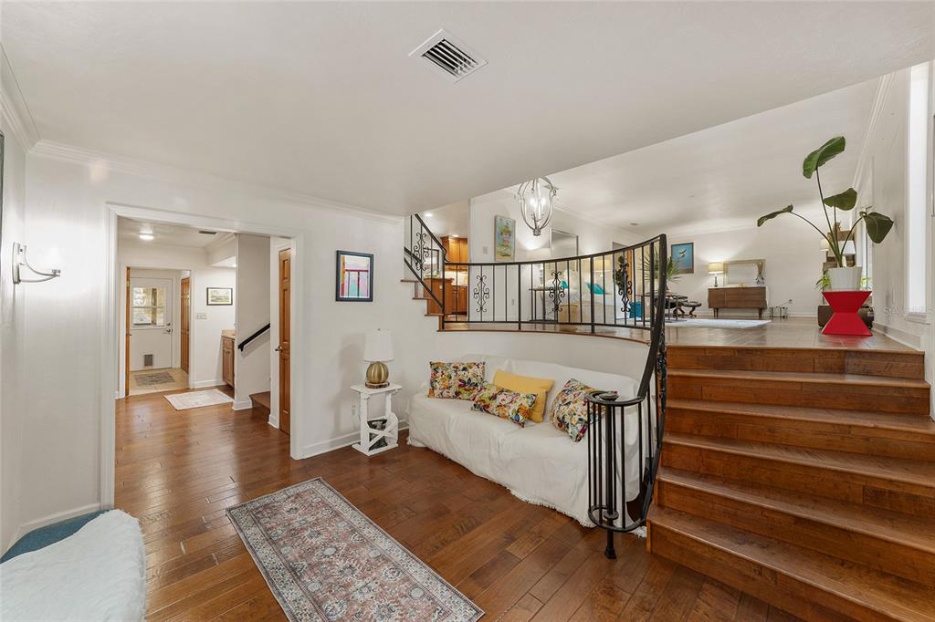 6015 Southwest 36th Way Gainesville, FL 32608 - Photo 14 of 67 a living room with furniture and wooden floor