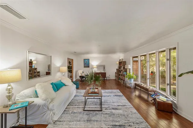 a kitchen with stainless steel appliances granite countertop a sink counter space and wooden floor