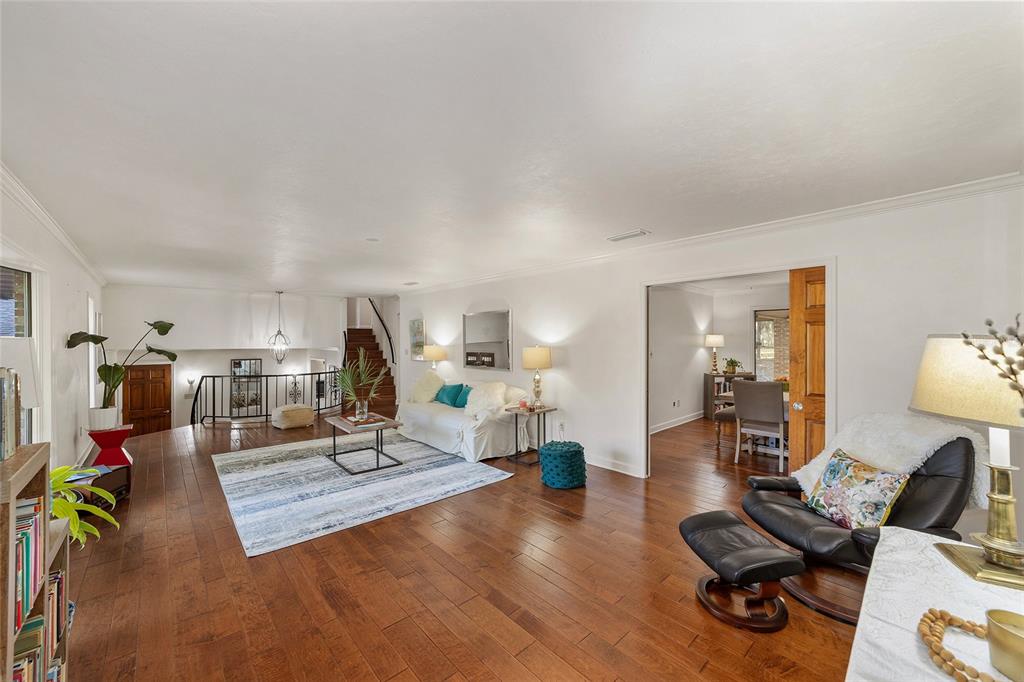 6015 Southwest 36th Way Gainesville, FL 32608 - Photo 20 of 67 a living room with furniture and a wooden floor