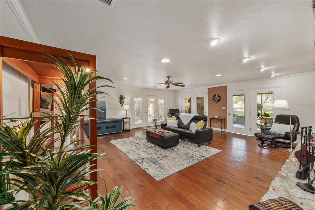 6015 Southwest 36th Way Gainesville, FL 32608 - Photo 31 of 67 a living room with furniture fireplace and potted plant
