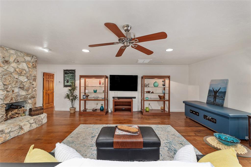 6015 Southwest 36th Way Gainesville, FL 32608 - Photo 32 of 67 a living room with furniture and a flat screen tv