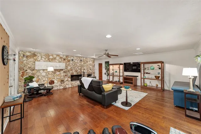 a large kitchen with granite countertop a refrigerator and a stove top oven