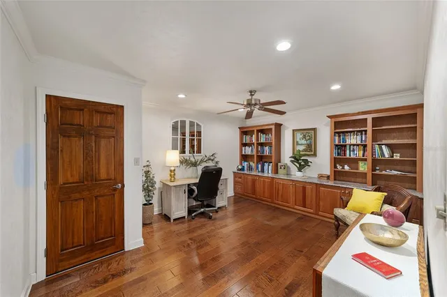 a bathroom with a tub a sink and a window