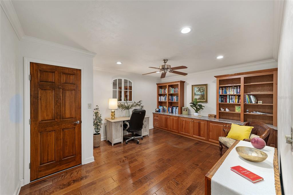 6015 Southwest 36th Way Gainesville, FL 32608 - Photo 34 of 67 a room with furniture and a book shelf
