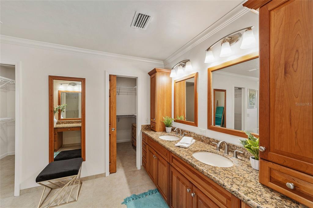 6015 Southwest 36th Way Gainesville, FL 32608 - Photo 39 of 67 a bathroom with a double vanity sink and a mirror