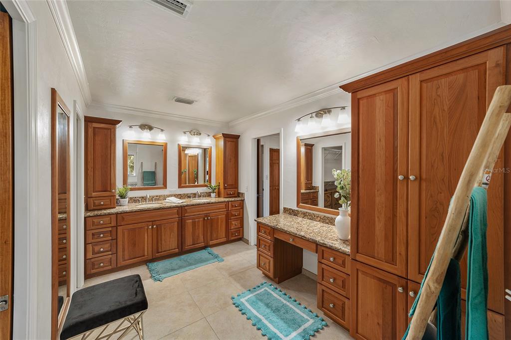 6015 Southwest 36th Way Gainesville, FL 32608 - Photo 40 of 67 a large kitchen with granite countertop a refrigerator and a stove top oven
