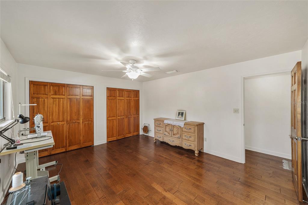 6015 Southwest 36th Way Gainesville, FL 32608 - Photo 45 of 67 a living room with furniture and wooden floor